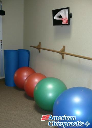 Image of four exercise balls & two yoga mats